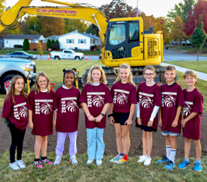 Students posing before digging